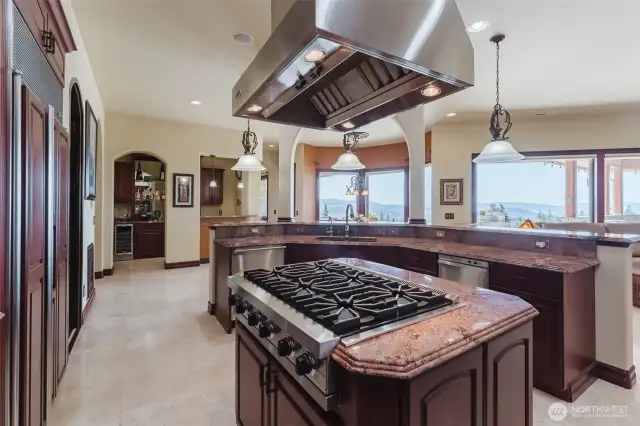 Enjoy Bay, Lake, and city views from your kitchen- as well as the gorgeous pool and patio. The outdoor kitchen is just outside for grilling and entertaining.