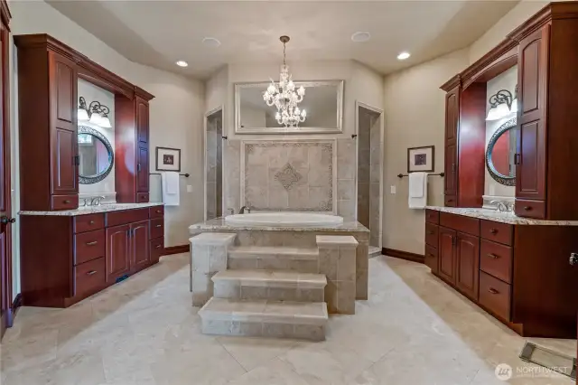 Primary suite bathroom with jetted tub, and walk through shower