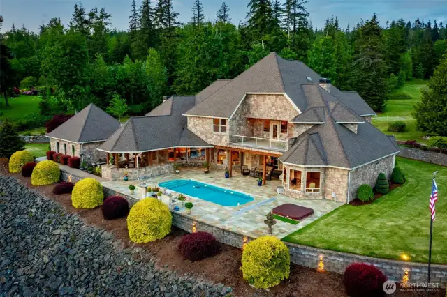 The 2.5 acres is situated in a professionally landscaped, park-like setting with extensive hardscaping and beautiful vistas. Enjoy the resort-quality pool, putting green, frisbee golf and fire pit- just in time for summer!