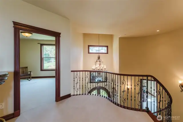 At the top of the staircase is a bonus/game room, and bedroom with ensuite bath