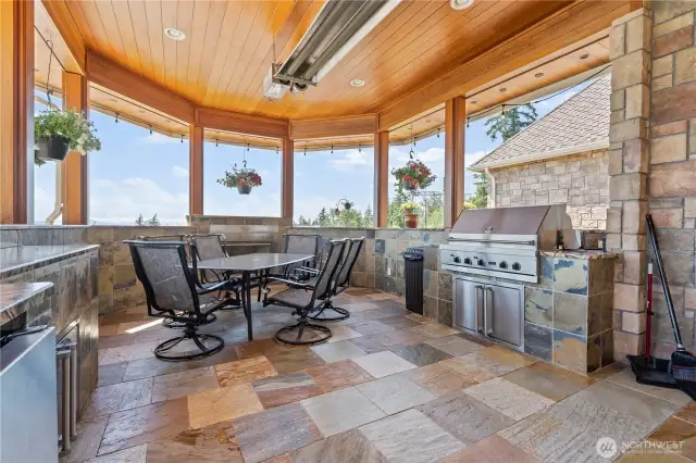 The fabulous outdoor cooking area features an infrared overhead heater and upgraded 5000 BTU gas fireplace to keep you warm year round. The chef will love the 36" Viking Professional BBQ/Smoker with Rotisserie, prep area and Viking refrigerator. The California Gold Slate walls and Rainforest Marble countertops make it a very unique and special place to gather.