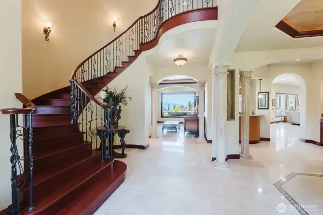 The custom Brazilian cherry and iron staircase is a work of art made by a local artisan