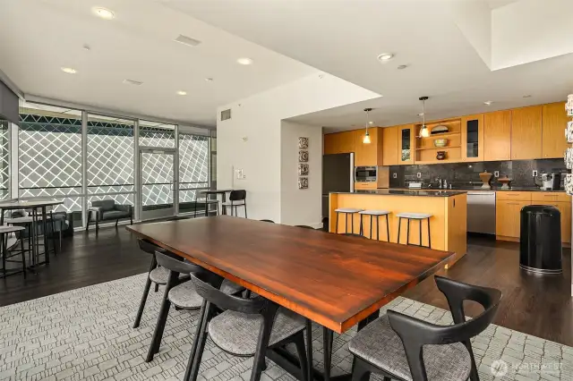 Club room with kitchen, adjoins business meeting space (not shown) and outdoor sky lounge