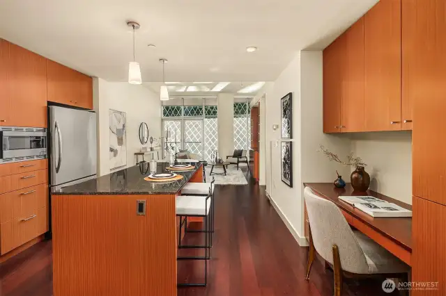 Enter to hardwood floors and a chef's kitchen
