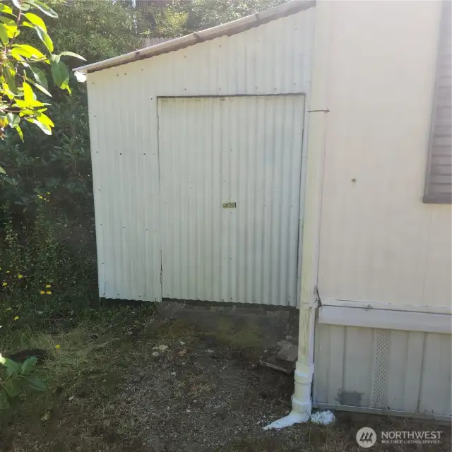Shed at exterior far end of home