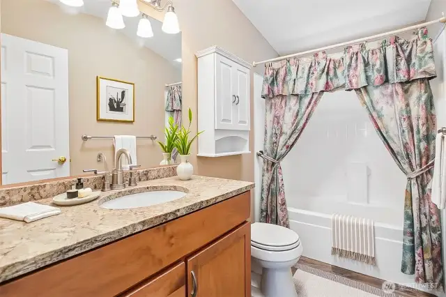 Hall full bathroom.  virtually staged photo.