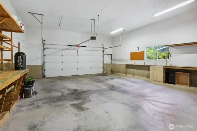 Attached oversized 2 car garage with workshop space.