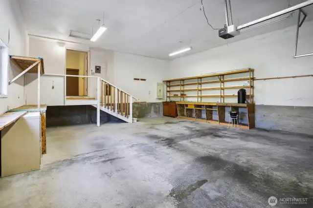 Attached oversized 2 car garage with workshop space.