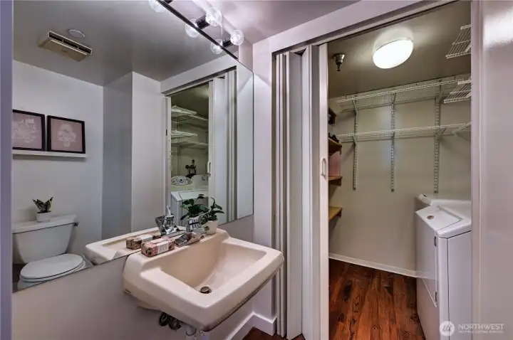 An additional powder room for convenience for guests & laundry/storage area.