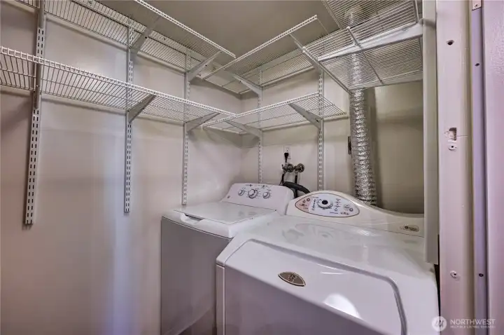Wonderful side by side laundry with shelving for maximum storage & organization.