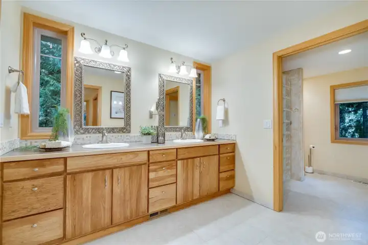 Bathroom in addition with double sinks and walk in shower.
