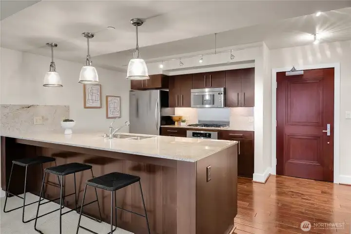 The kitchen dining bar is nice and long, and it is a good place to sit and visit.