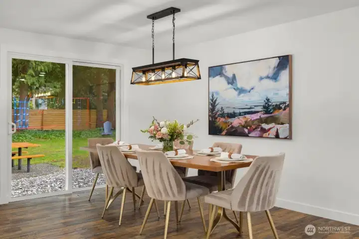 Dining leads to spacious backyard