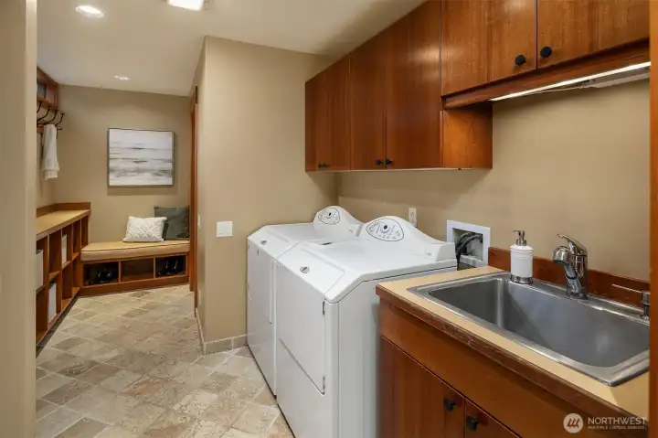 Large Laundry Room with utility sink and ample storage