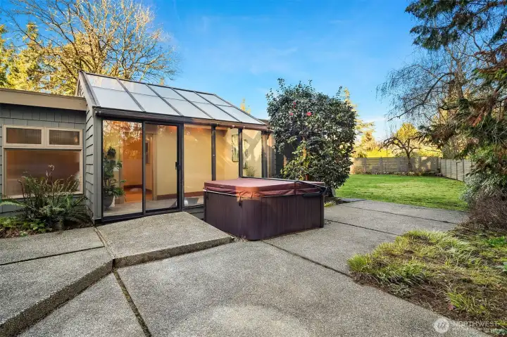 Back patio that extends to a huge back yard with large garden beds