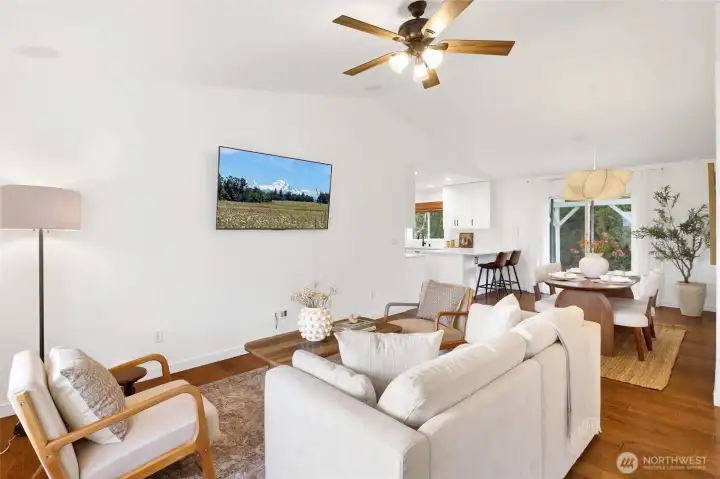 The spacious living room is ready to host it all, offering the perfect gathering space for friends and family. It flows seamlessly into the dining area off the kitchen, making everyday living and entertaining feel effortless.