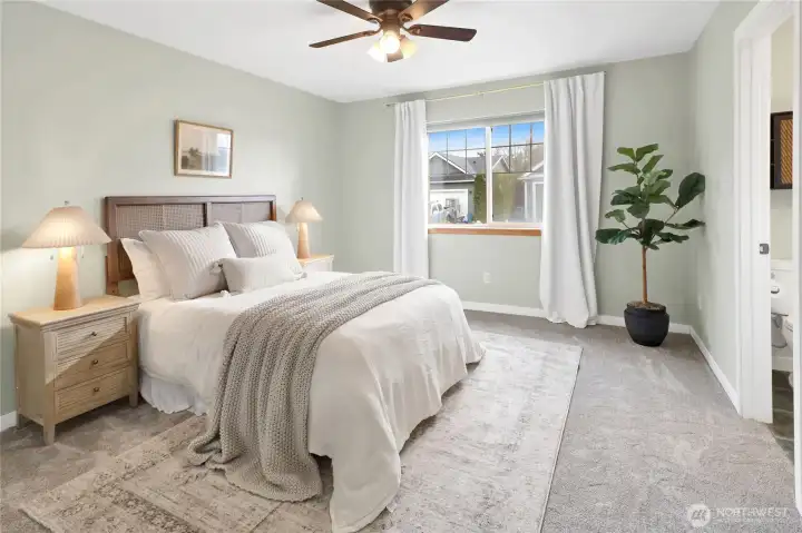 The primary bedroom is a true retreat, featuring a spacious walk-in closet and a private en-suite bath for ultimate comfort and convenience.