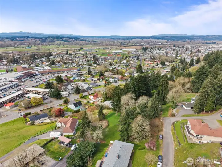 Drone view of property and surrounding area.
