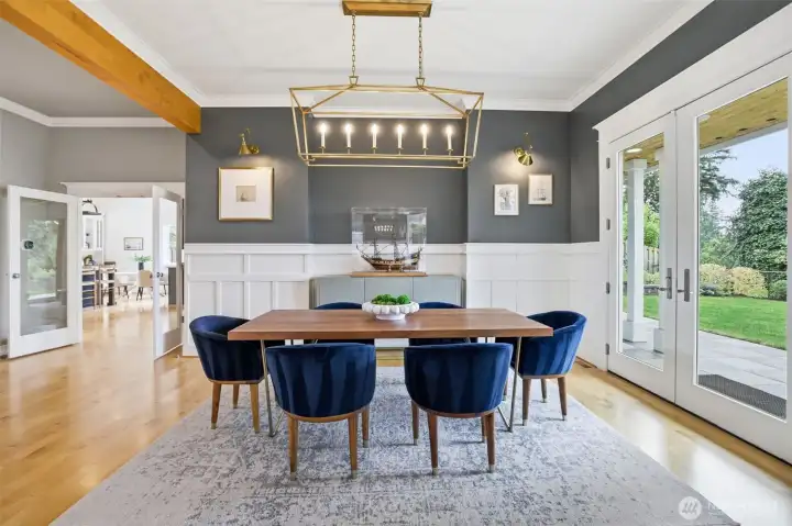 Dining room with kitchen and family room in the background.