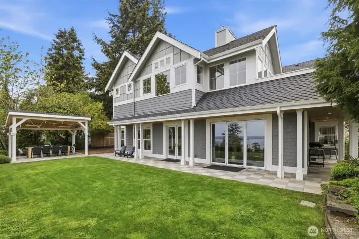 Covered pergola with ceiling hung heat lamps for year around enjoyment.
