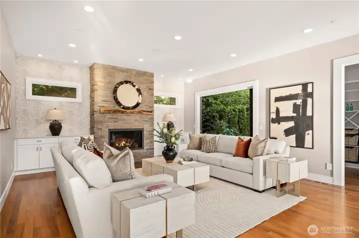Rich hardwood floors, abundant natural light, and gallery-inspired spaces set the tone for this architecturally stunning residence.