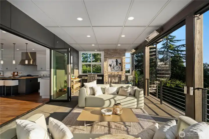 Cantina folding doors open effortlessly to the expansive view deck, creating seamless indoor-outdoor living