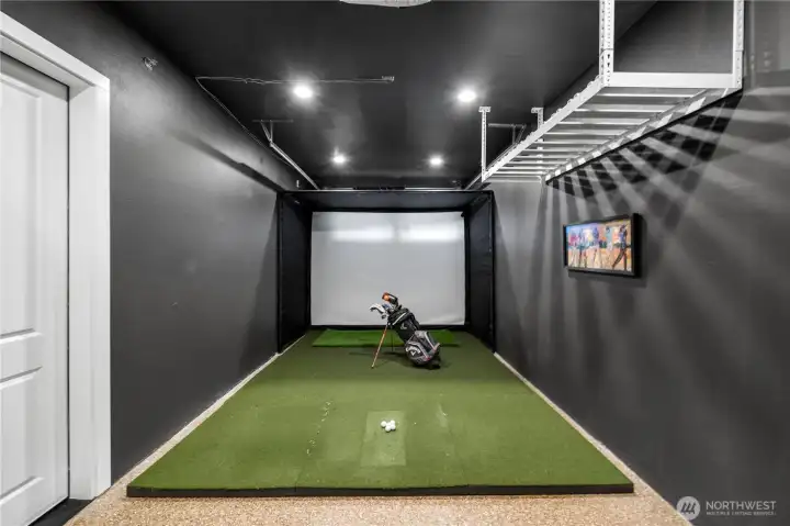 One garage bay converted to a  Golf Simulator with 12-foot impact enclosure, Turf flooring, 4K projector,27-inch touchscreen - Ready for launch monitor & gaming PC