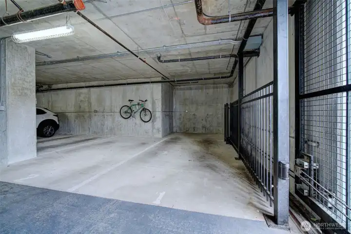 Secure garage space with outlet for EV charging.