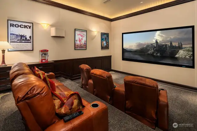 Settle in for movie night in your Custom Theater, featuring 140 Inch Screen with Projector, Built-in Cabinetry and custom Leather Seating.