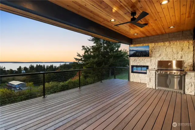 Built in BBQ/Cooking space & fireplace w/views from outdoor covered living space.