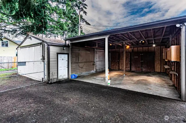 Large carport & shop off the alley.  Rear yard has gates off the alley.