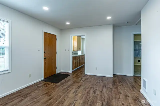 Living room opens to the kitchen to left & bedrooms and bathroom to the right.