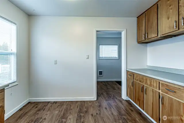 Laundry/mudroom off the kitchen opens to the backyard.