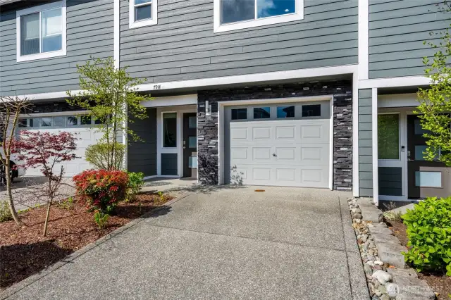 Flat Driveway. Single Door 2 Car Garage.