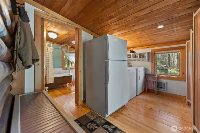 Mud room with laundry area.