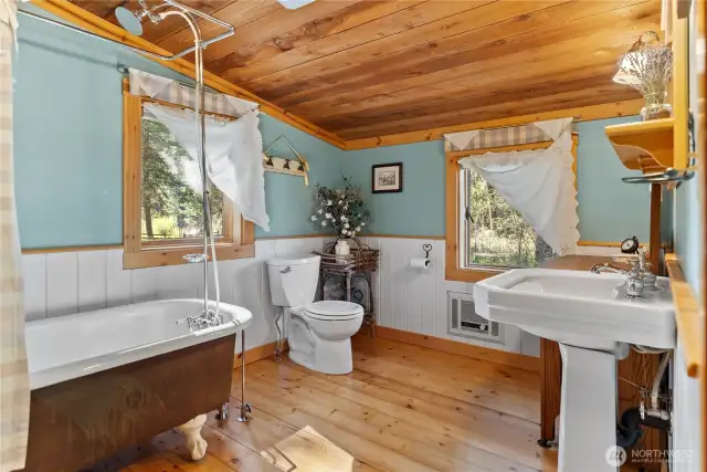 Spacious bathroom with claw-foot tub