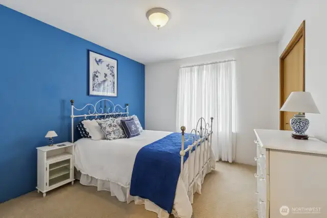 Ample sized second bedroom with a relaxing coastal-inspired ambiance.