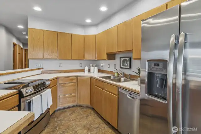 Stylish kitchen featuring abundant and sleek stainless-steel appliances.