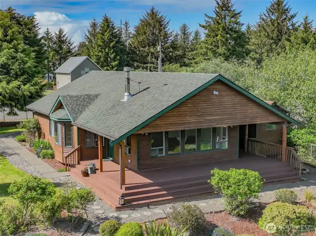 Front view with wraparound deck and large windows perfect to see the migrating birds