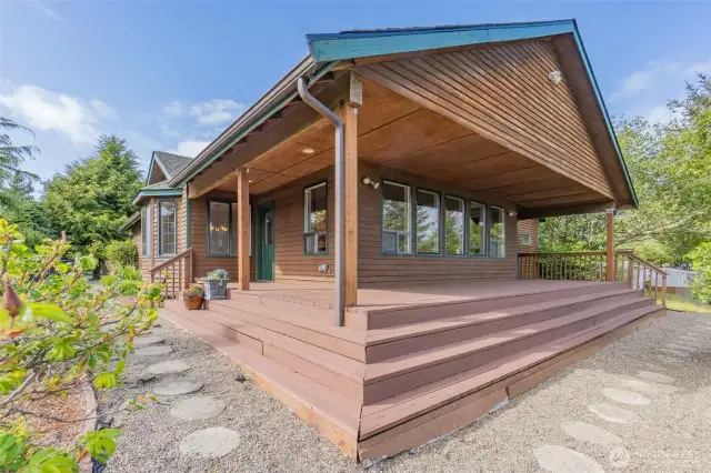 Expansive wraparound deck featuring newly installed posts for added charm and support
