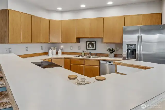 Spacious countertops and ample cabinetry paired with stunning stainless-steel appliances.