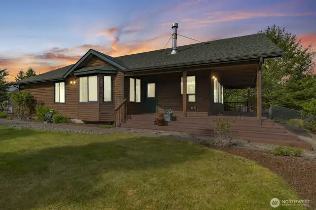 Bathed in twilight’s gentle glow, the home and landscape unfold in quiet beauty and depth