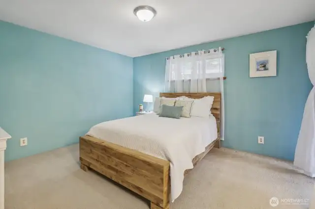 Spacious and inviting, the Primary Bedroom blends cozy comfort with luxurious style.