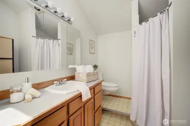 Bathroom in Studio Apartment  includes a walk-in shower