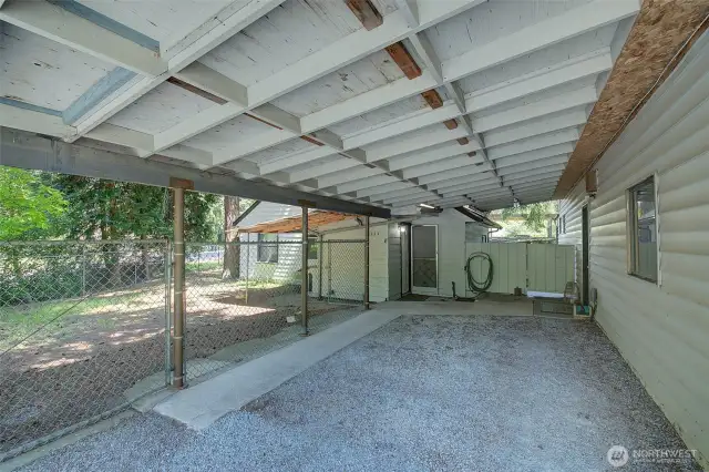 An additional carport adjoins the house and garage
