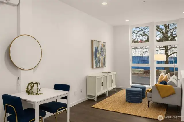 Livingroom features new window treatments and a minisplit for heating and cooling.