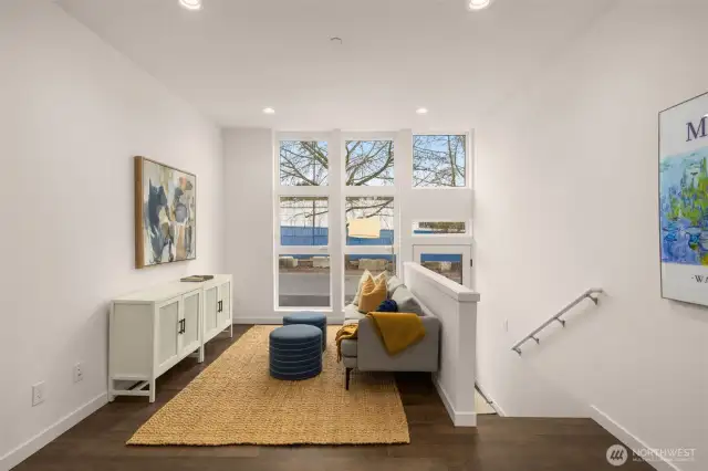 Livingroom features new window treatments and a minisplit for heating and cooling.