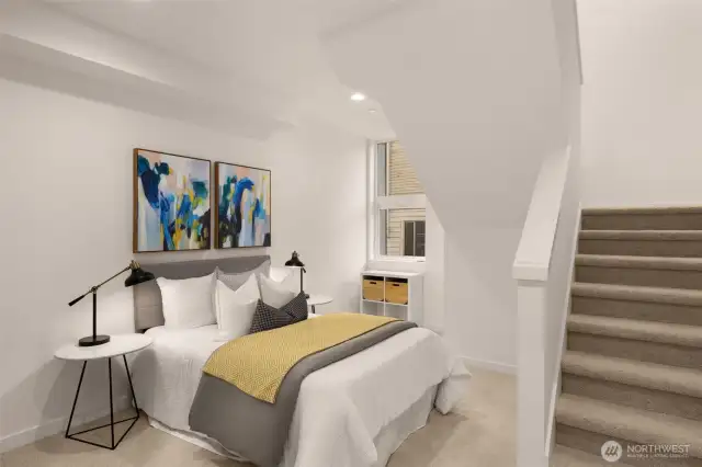 The lower level features a bedroom and a flex office space with a full bath.