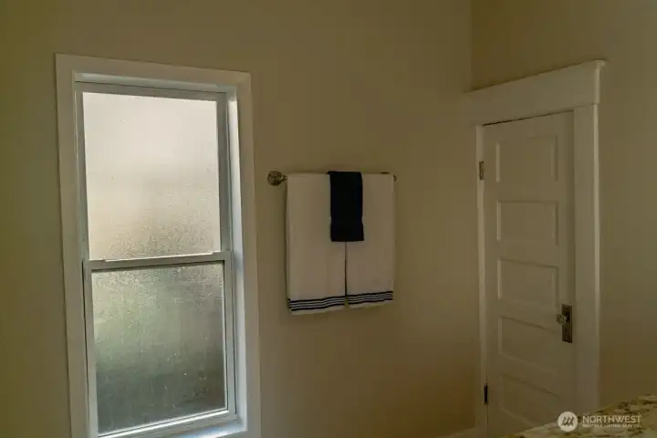 Large window in bathroom