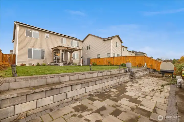 Retaining wall added creating seamless outdoor flow